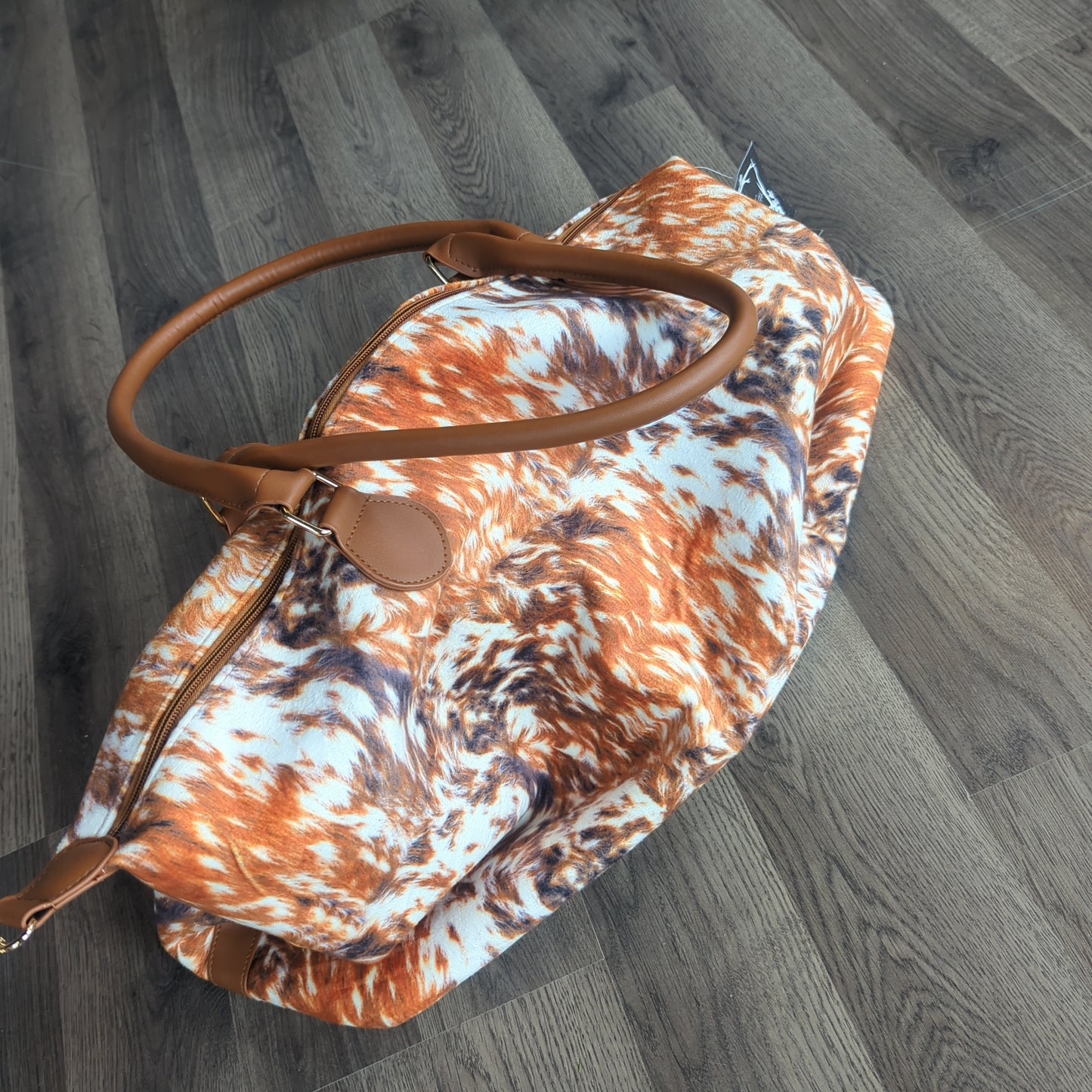 Cow print weekender bag